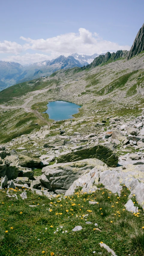 a mountain with some water and rocks