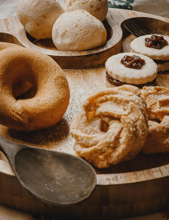 a variety of baked goods are on a plate with spoons