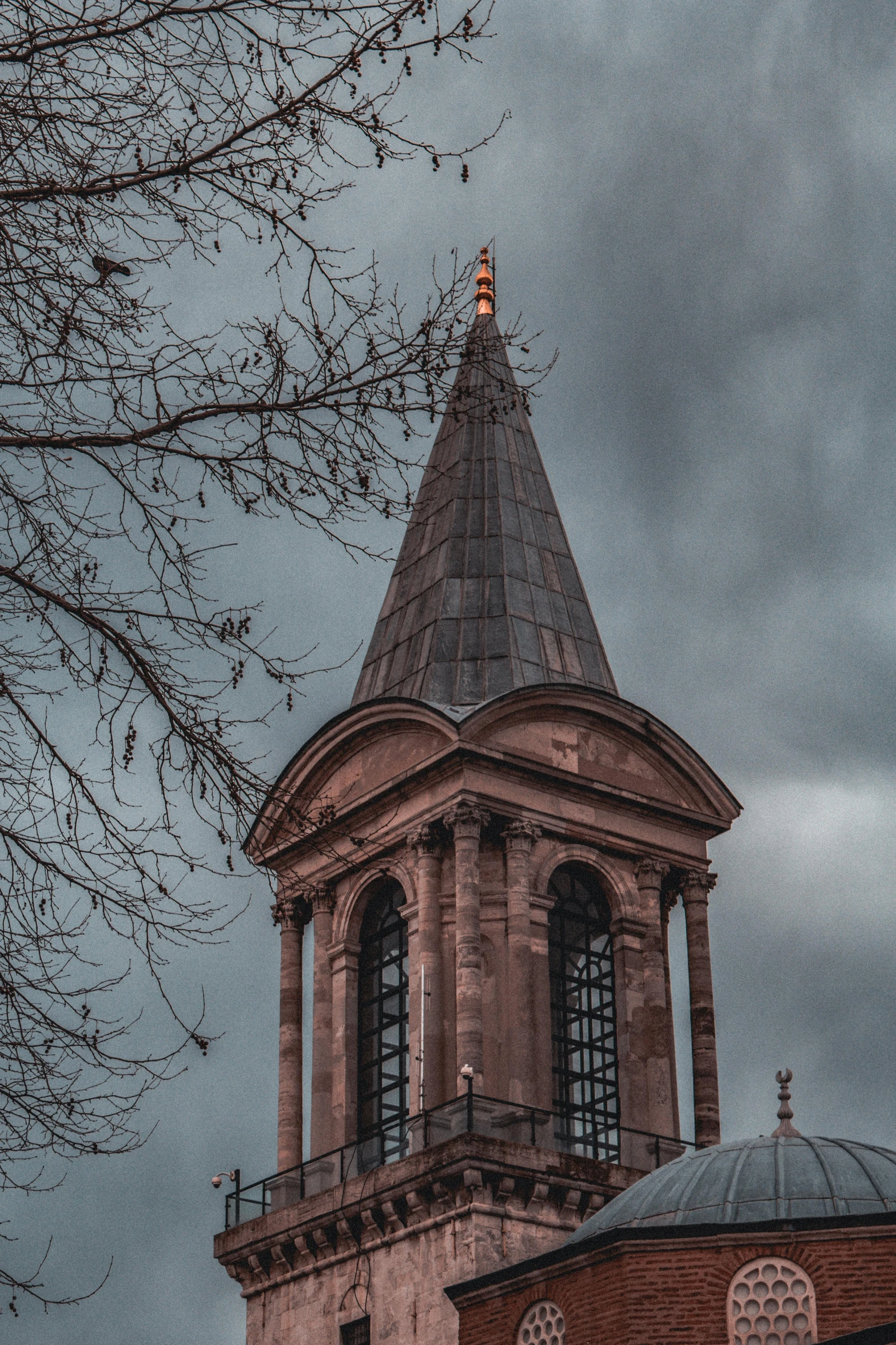 a small building with a dome on top