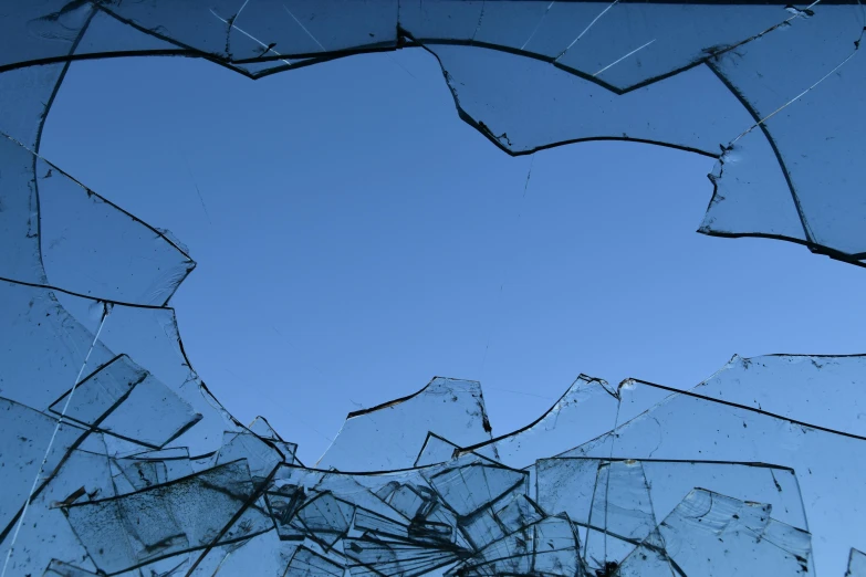 broken glass with some blue sky in the background