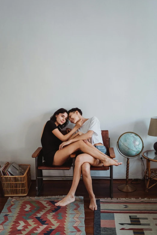 a couple hugging on a bench in a room