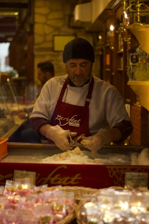 a chef preparing food behind the counter at a restaurant