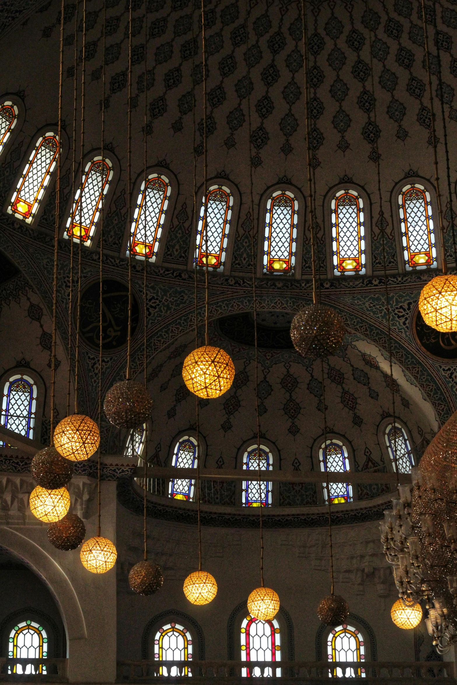 some fancy and big glass globes and a chandelier