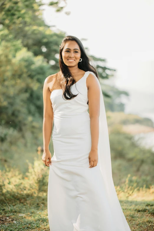 an older woman in a long white dress