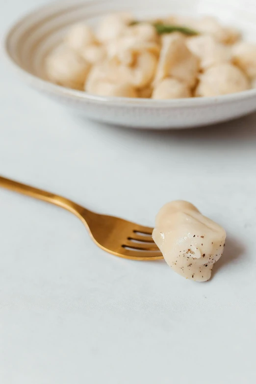 there is a spoon and fork beside two food items