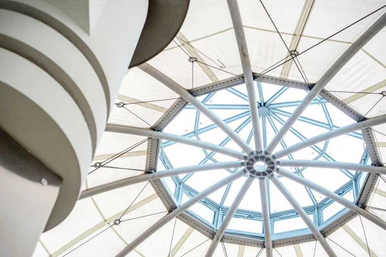 a view of a circular ceiling with skylights