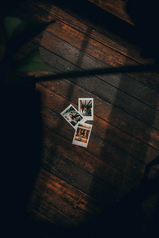 stickers of pos sitting on top of a wooden table