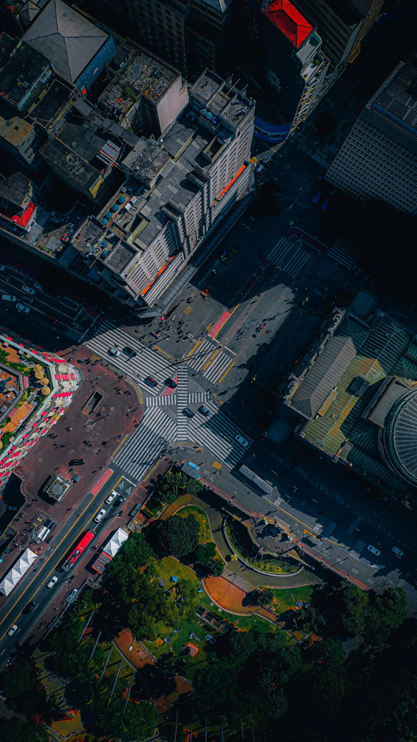 a street intersection taken from above looking down on a busy city street