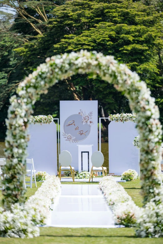 white floral decorations on a ceremony area set up for a ceremony