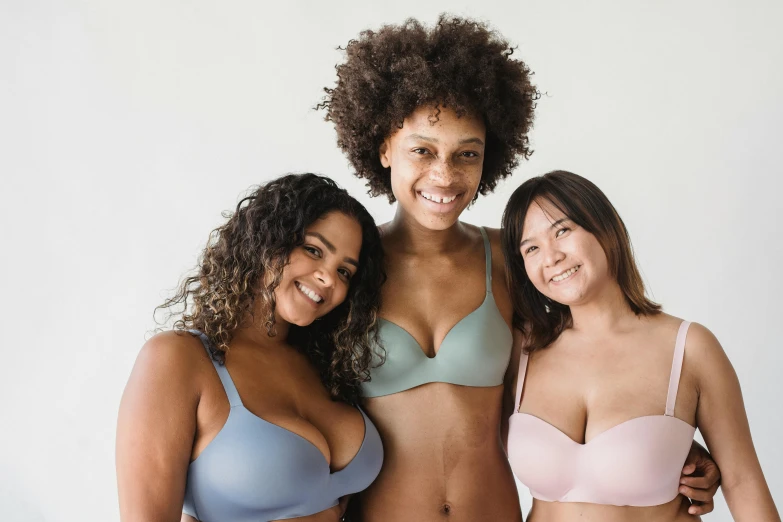 three beautiful women posing for a po