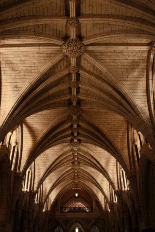 an aisle with vaulted ceilings and stained glass windows
