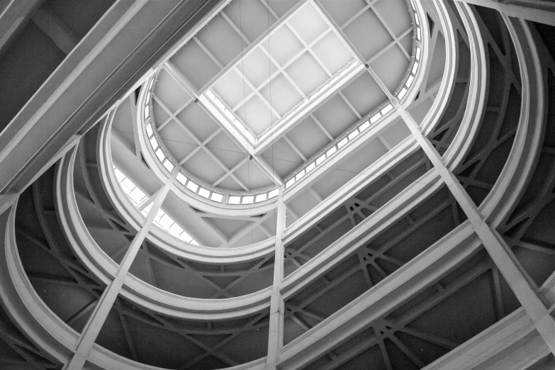 a black and white image with a circular ceiling