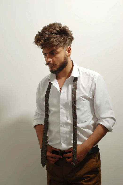 a man wearing suspenders and a white shirt