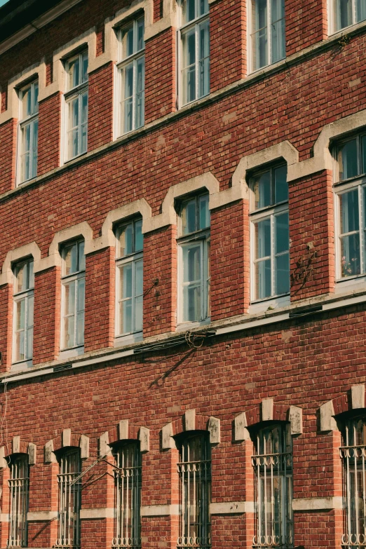 a tall brick building with a few windows