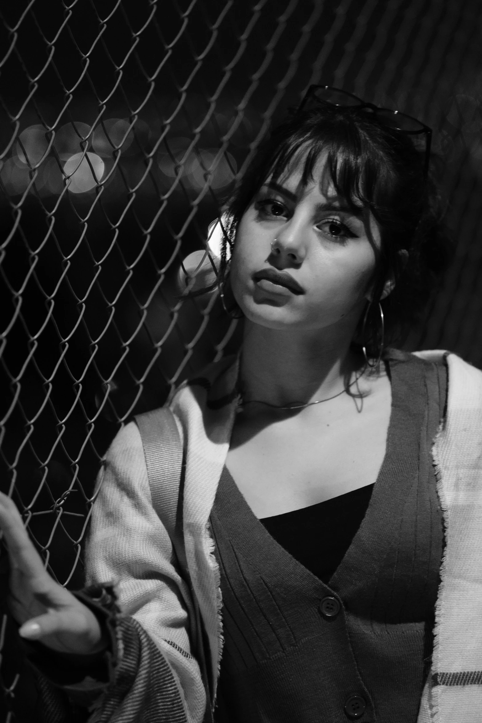 woman looking up near the wire fence