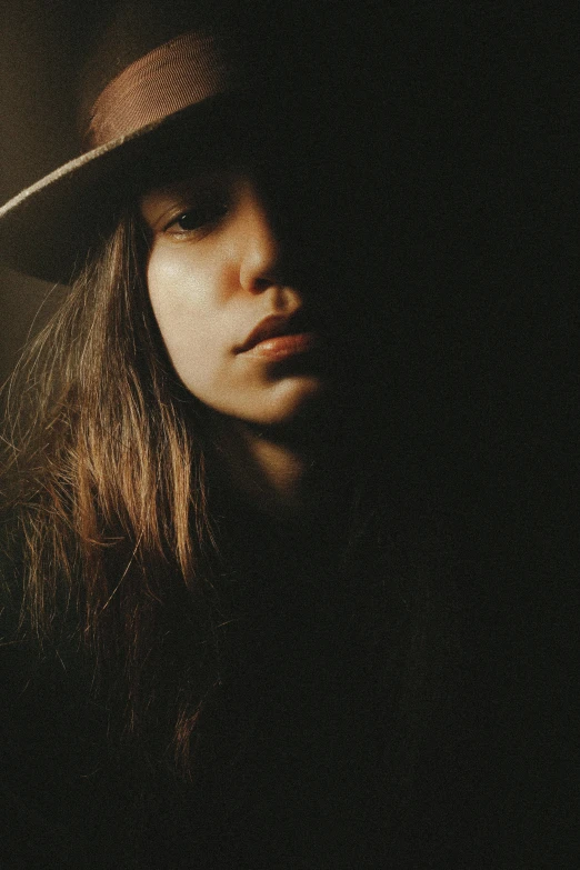 a close up s of a woman wearing a hat