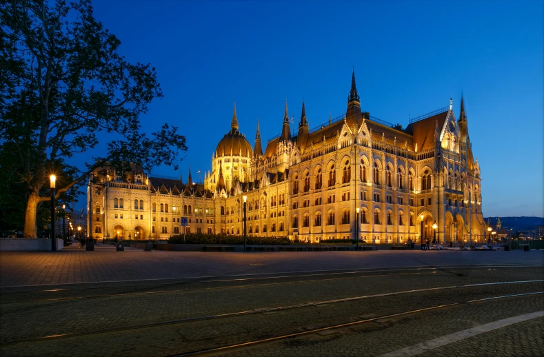 an ornate white building with towers at night