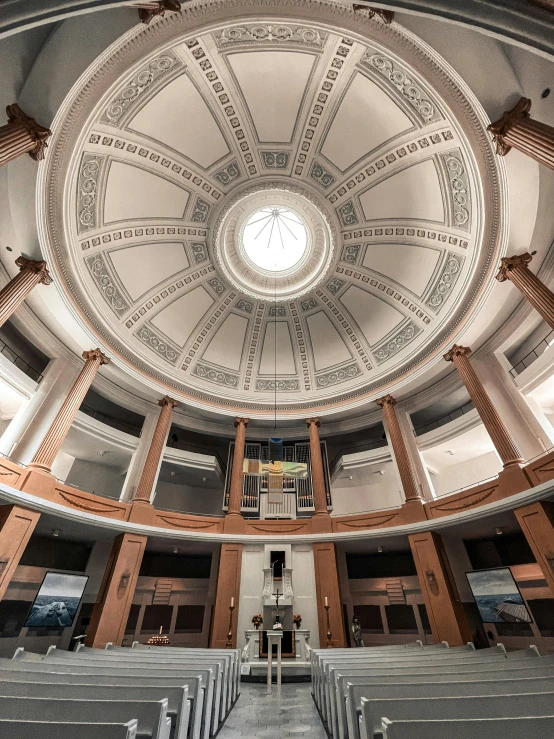 a dome with a clock inside the middle of it