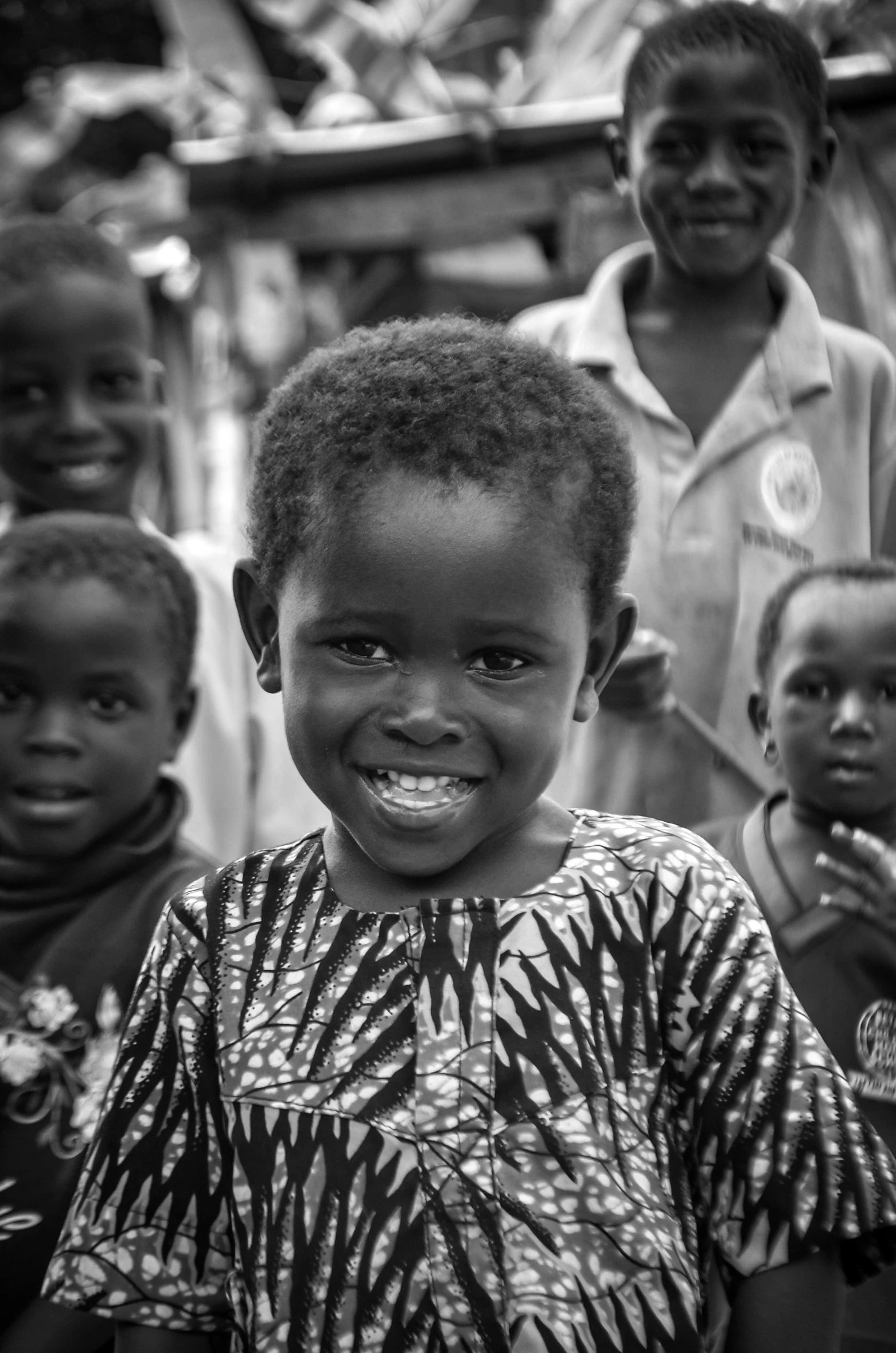 some children in a black and white po with a smile