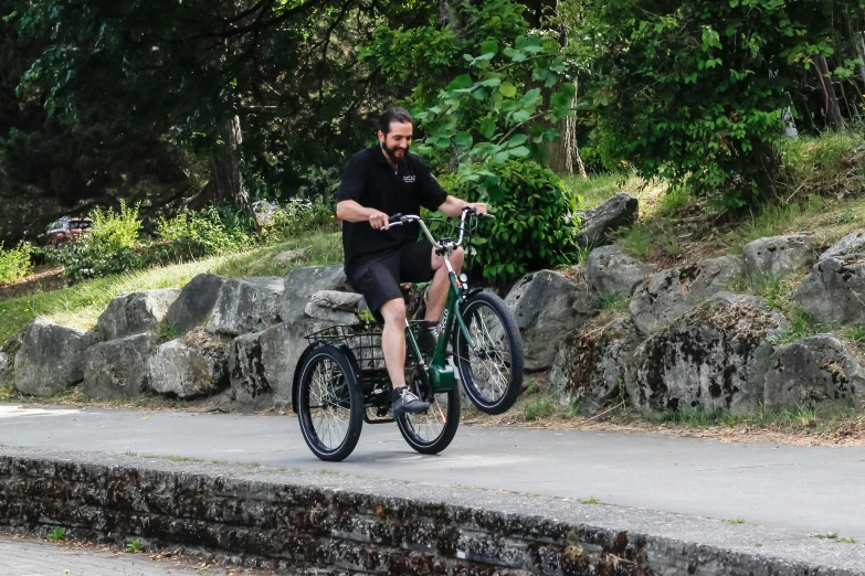 a man is riding a bicycle on a bridge