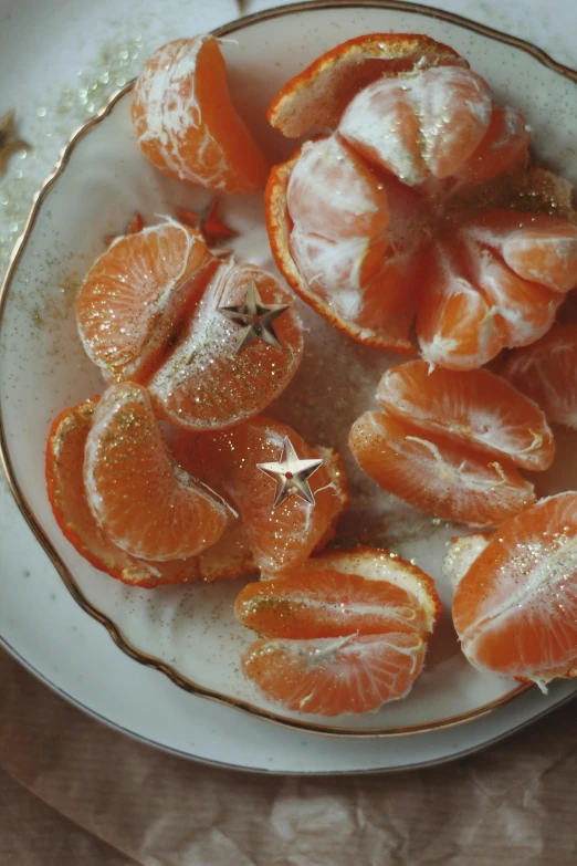 an orange is sitting in a bowl with other pieces