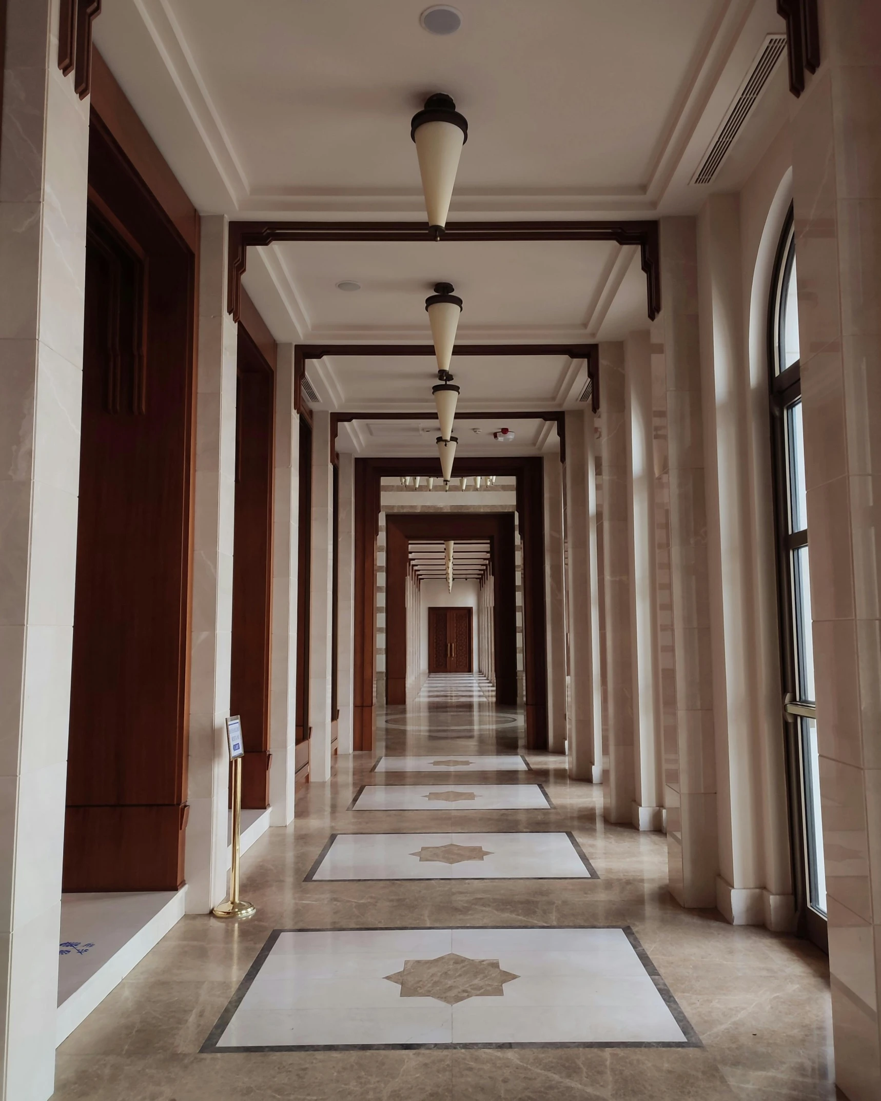 the hallway is lined with fancy floor tiles