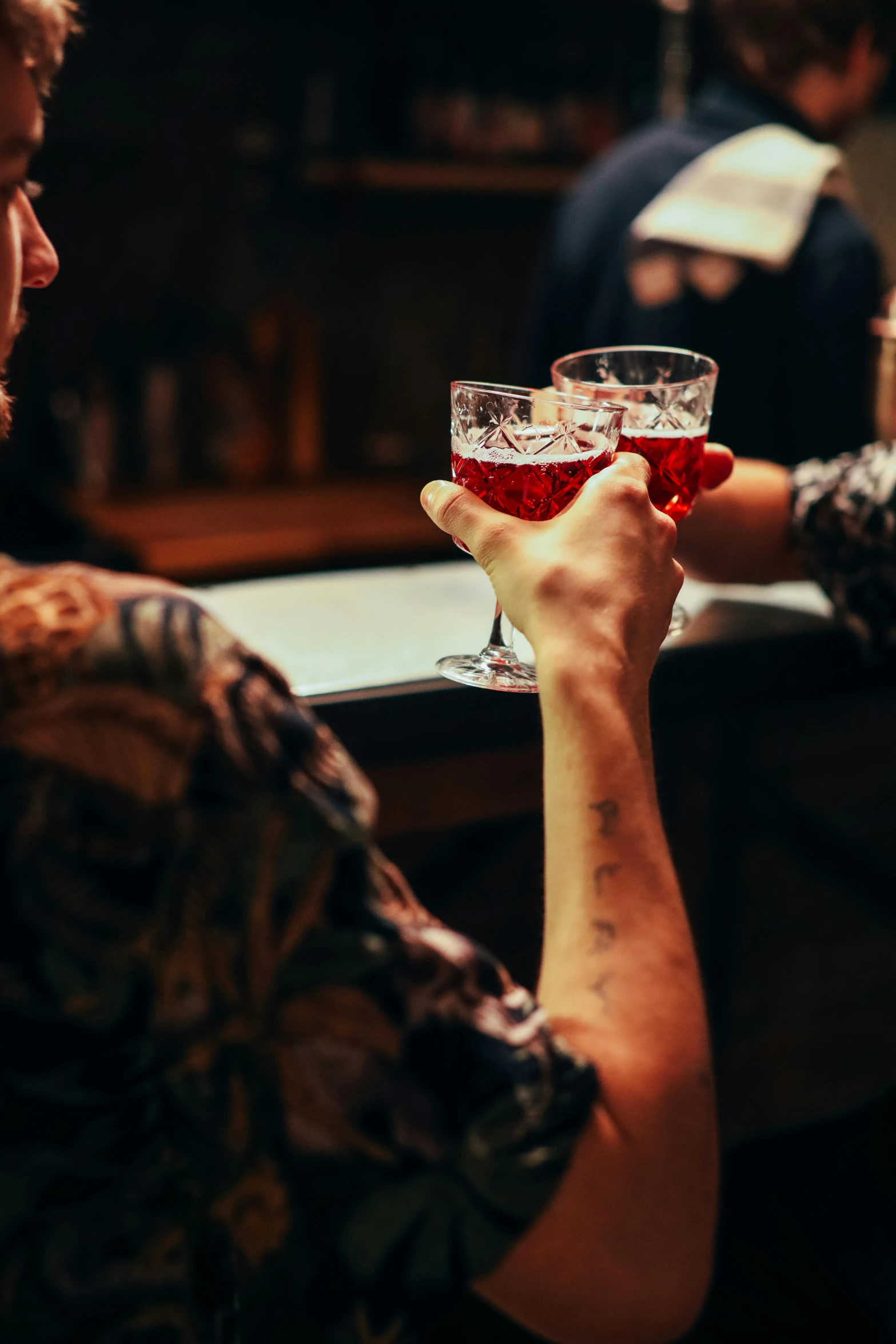 people having a drink in an old fashioned glass