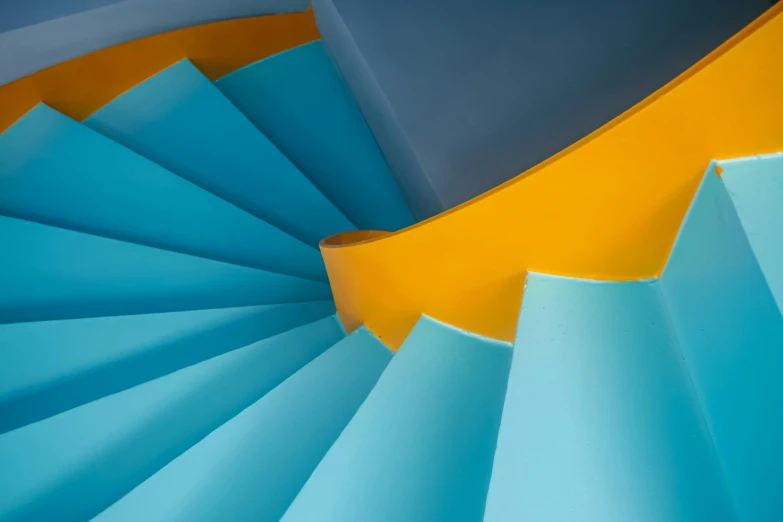 the image shows a large circular staircase that resembles an abstract background