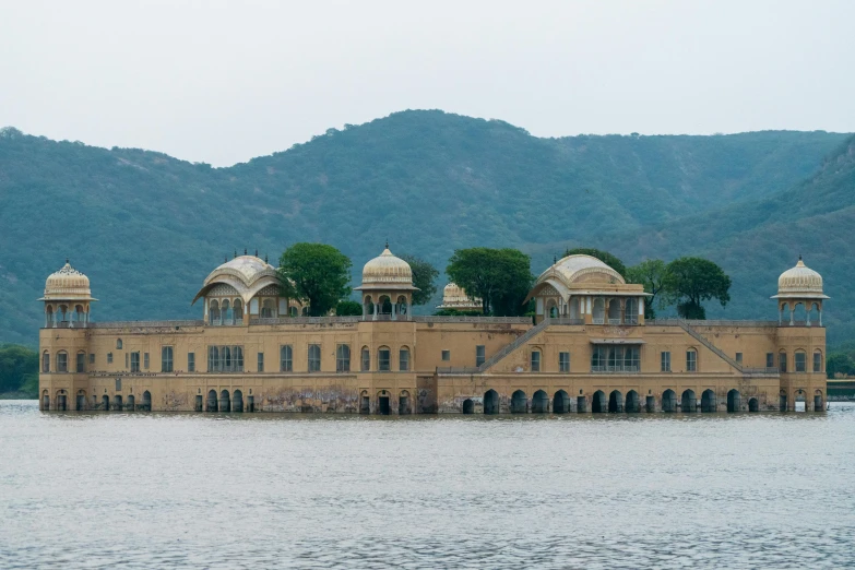 an old building with two water towers in the middle