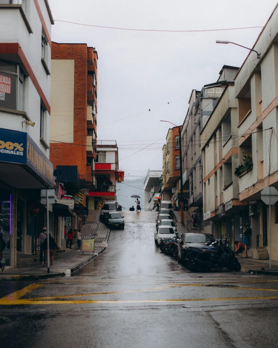 people walking on the side walk of a street