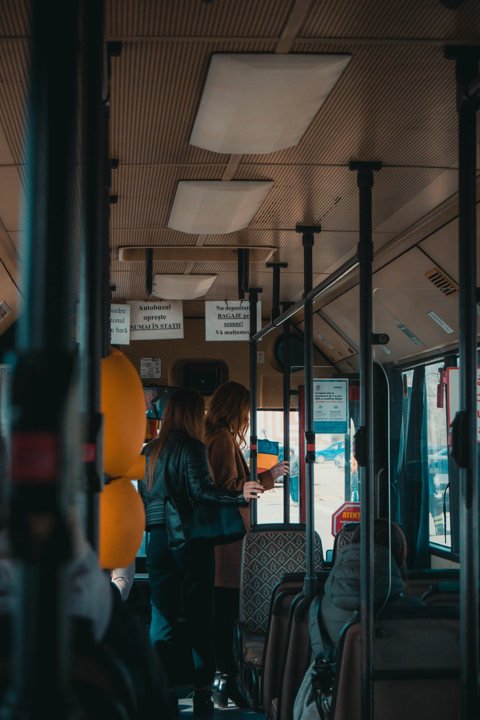 people are sitting in a bus and talking