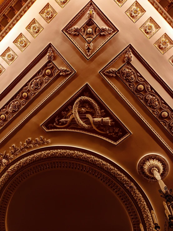 a ceiling that has many design and designs on it