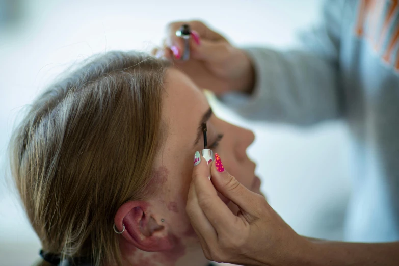 a man having his hair cut at the salon