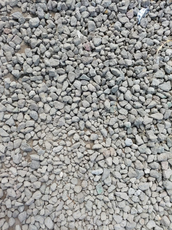 the concrete is piled high with little rocks