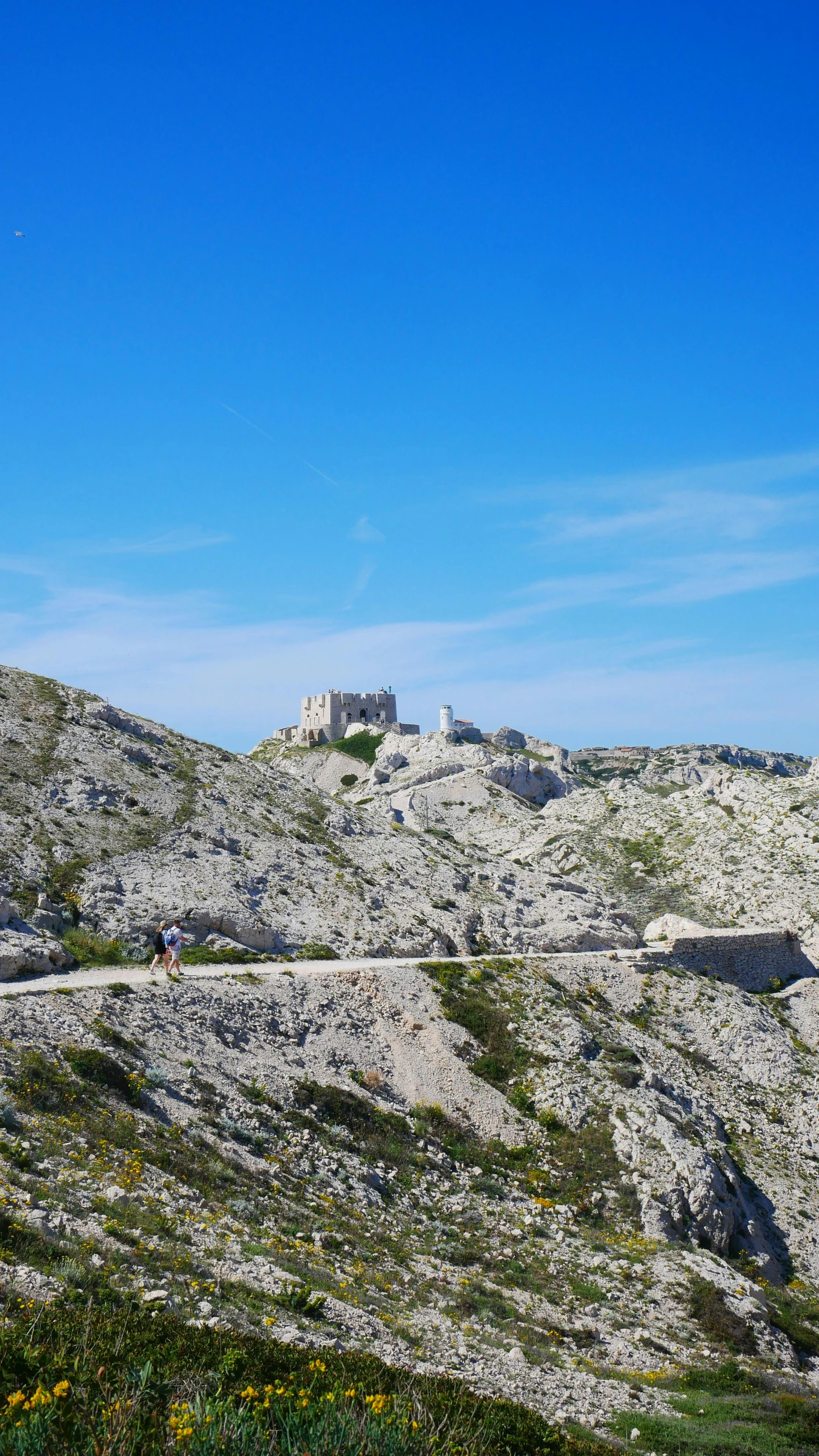 a very big pretty rock with a big tower on top of it