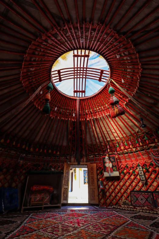 inside a yurt that contains the interior door and a round window