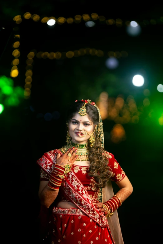 a beautiful woman in red and gold in costume