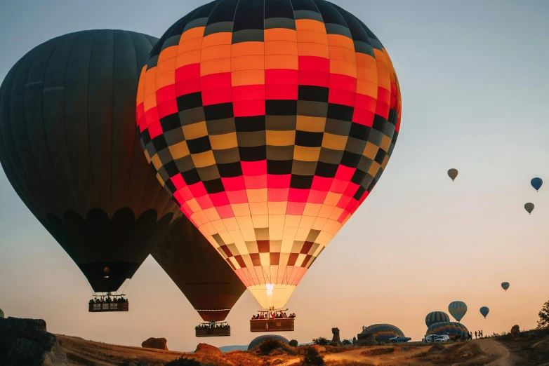 a number of  air balloons flying in the sky