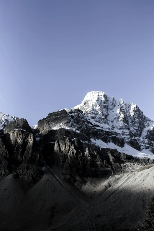 some mountains covered in snow and clouds