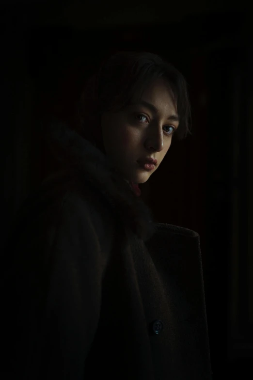 a dark po of a woman with a peacoat