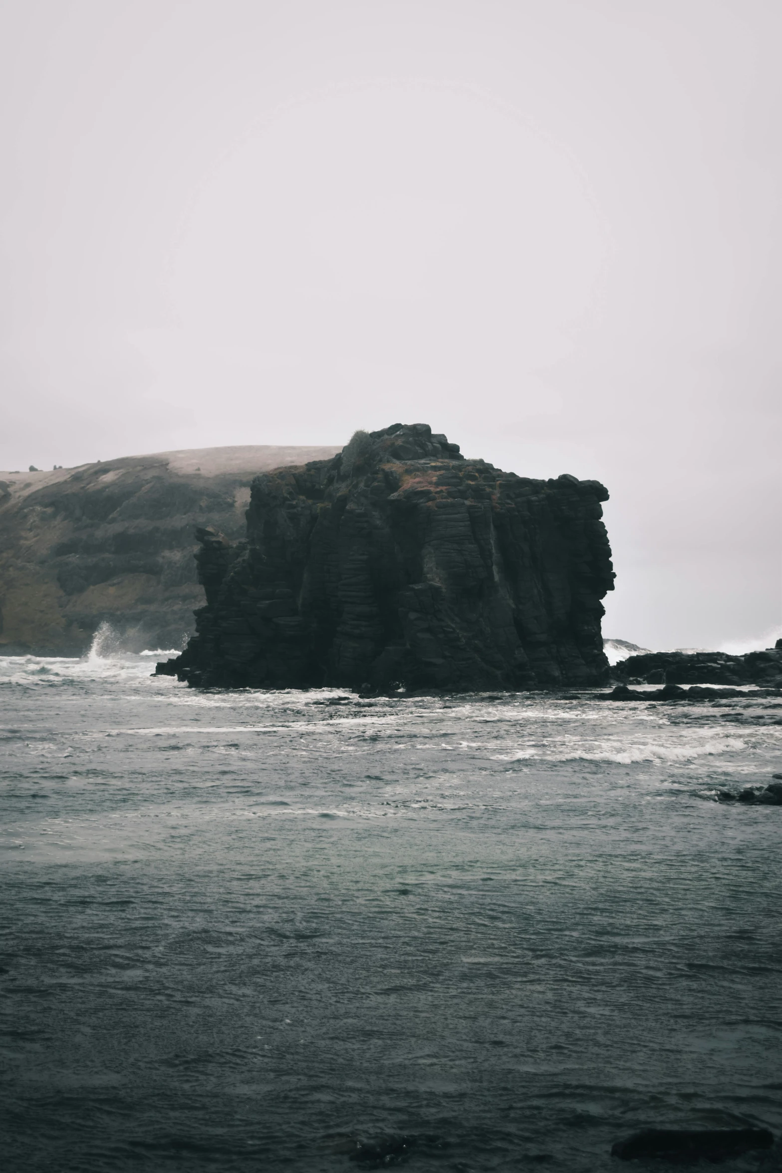 an area with some rocks and water near by