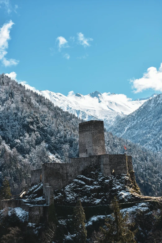 a mountain with a large castle on it's side