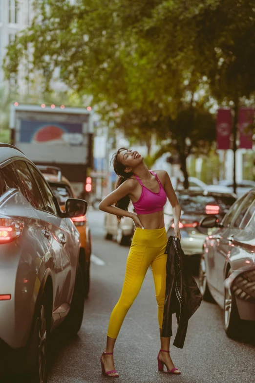 a person that is leaning on a car