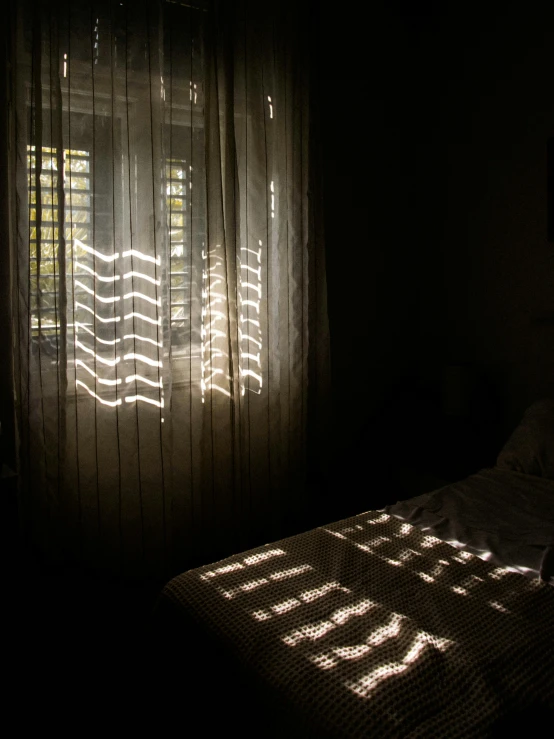 the light from a window on top of a bed