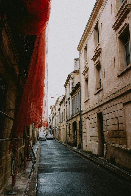 an empty street lined with buildings and old buildings