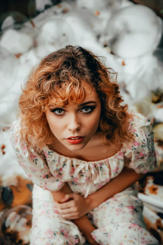 a woman in a dress poses for a po