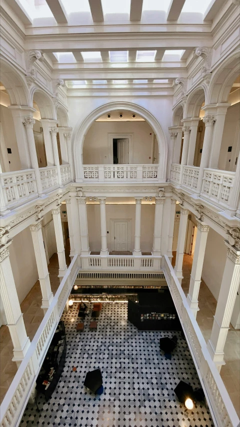 a black and white tiled floor inside of a building