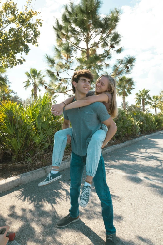 a man is hugging another woman on the street