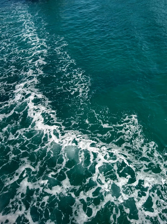 boat moving down the water towards shore