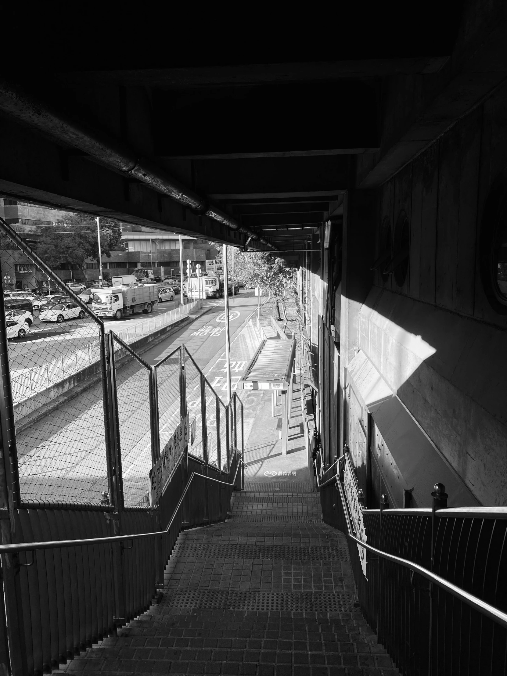 the stairs to a platform on a train track are empty